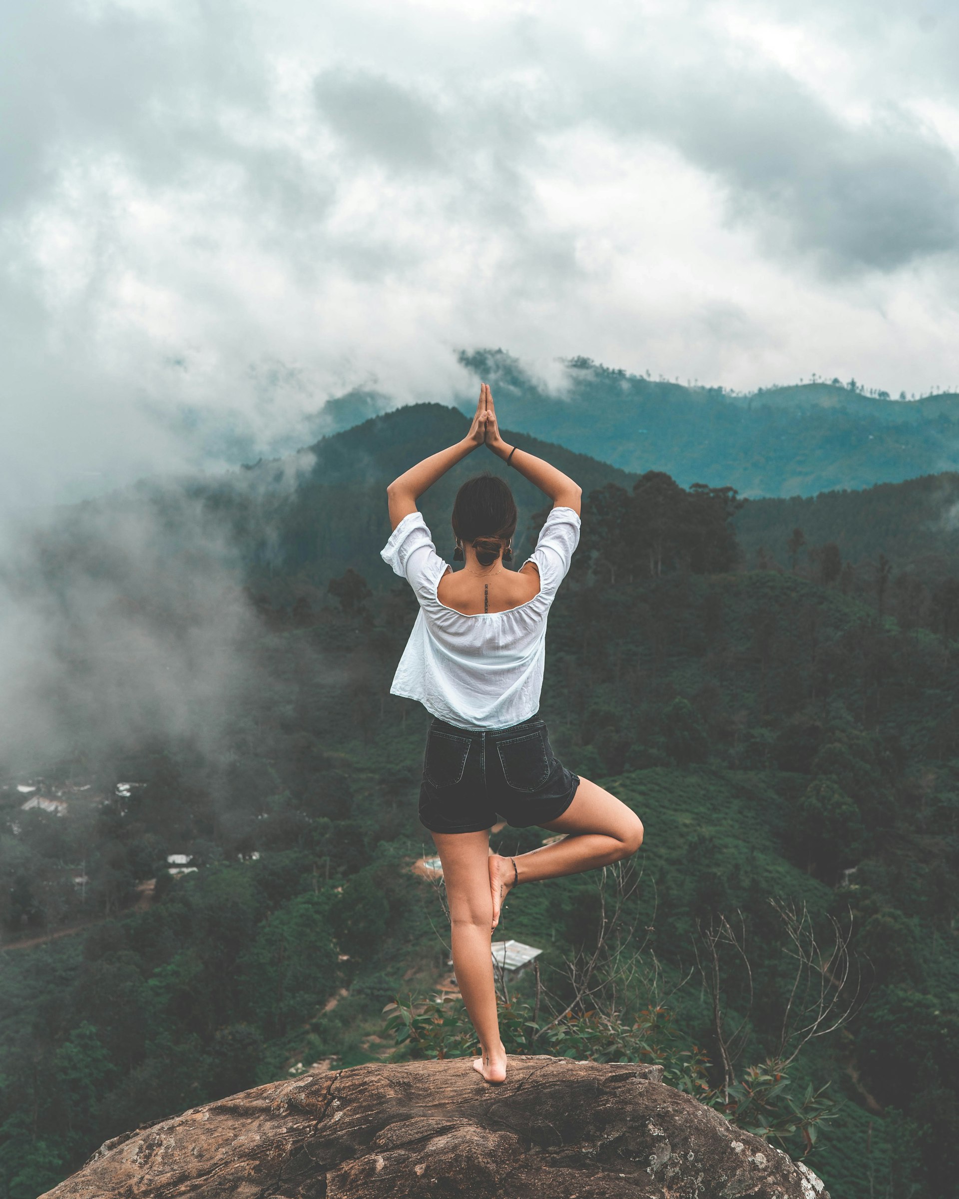 Person practicing Chi Kung (Qigong) outdoors, gentle flowing movement at sunrise Person practicing Chi Kung (Qigong) outdoors, gentle flowing movement at sunrise