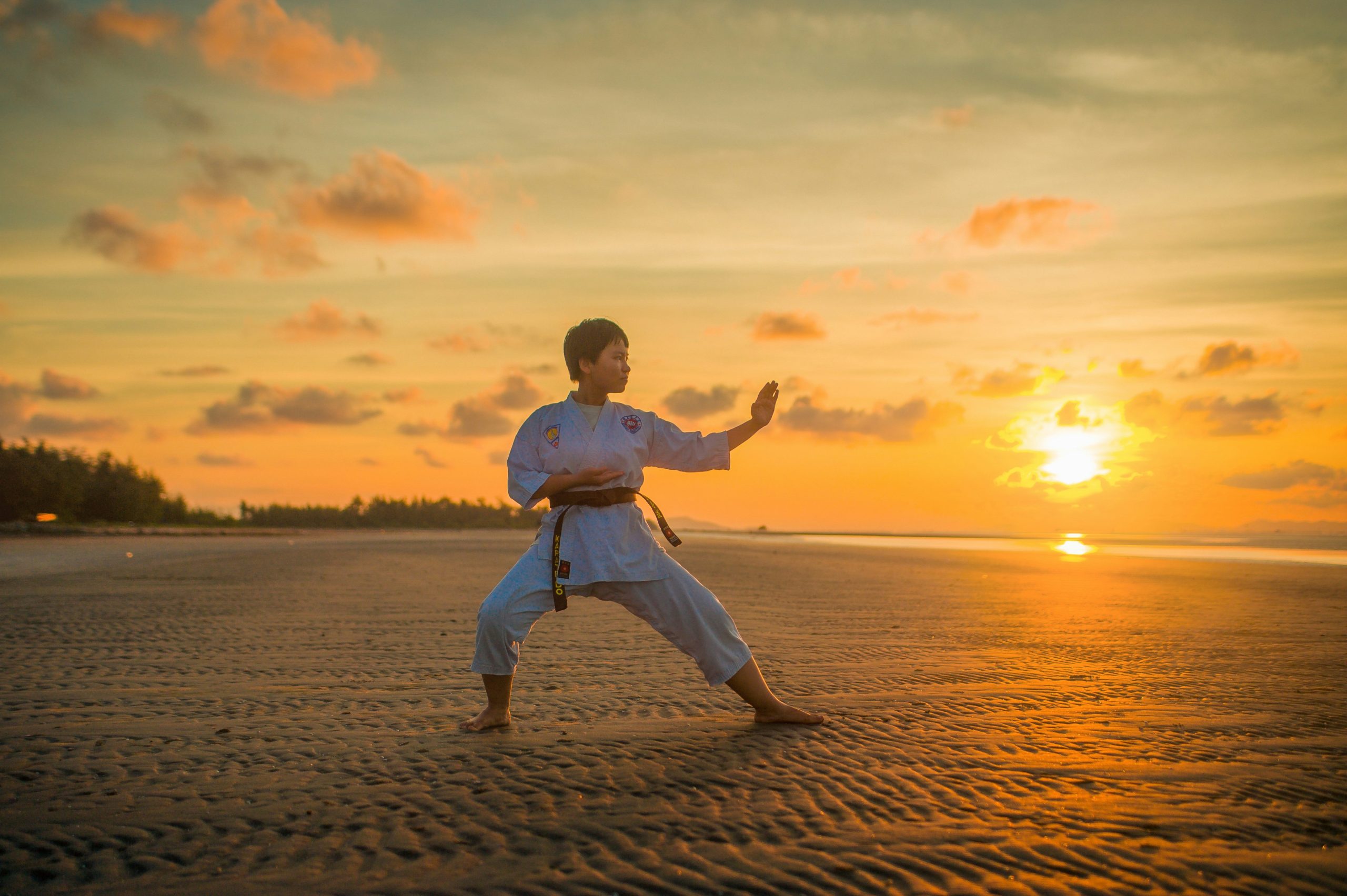 Teen training in traditional Kung Fu (功夫) during golden hour